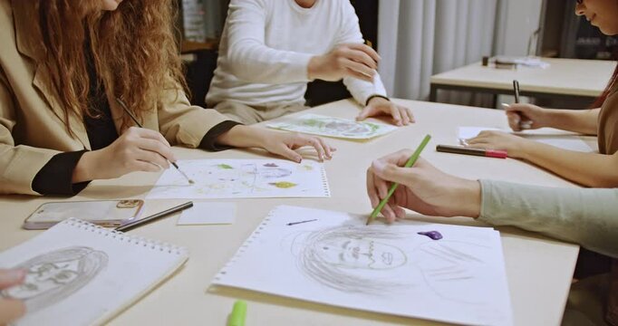 Students and their professor gather after class for a creative drawing and painting session, bonding through their shared passion for art and enjoying the collaborative experience.