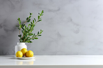 Modern minimalistic kitchen tabletop, countertop with marble surface and vase with olive branch and plant with lemons. Mockup table top for product advertising