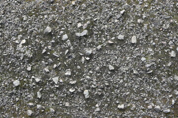 A gray and white background with a lot of rocks and pebbles