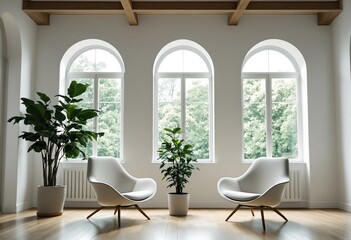 Two chairs in front of three large windows with plants on either side.