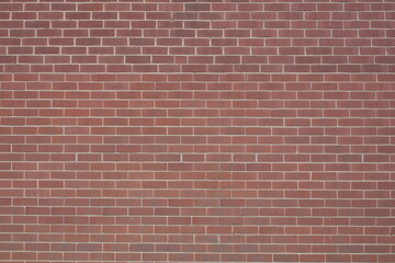 A brick wall with a red color