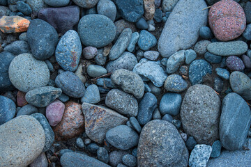 Mosaic of river stone rounded due to weathering by the flowing water of Hell Roaring Creek, Yellowstone National Park