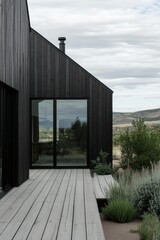 Fototapeta premium Modern architecture blends with nature in a serene mountain landscape showcasing a sleek wooden home and expansive outdoor deck surrounded by greenery