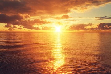 Obraz premium Breathtaking sunset over calm ocean waters with vibrant colors reflecting on the surface