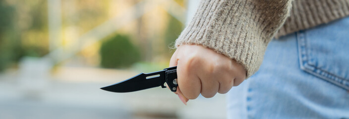 Revenge, woman with knife in hand prepares for murder