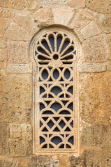 Fototapeta premium Visigothic Window: Lattice and Horseshoe Arch at San Juan de Baños.