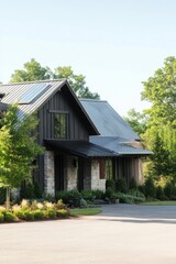 Charming modern farmhouse with stone exterior and lush landscaping set in a serene countryside location during bright daylight hours