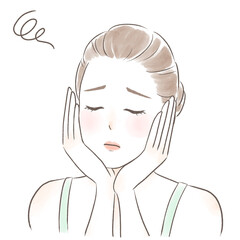 目を閉じて困った顔の両手で頬を包むキャミソールを着た女性