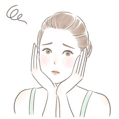 困った顔で両手で頬を包むキャミソールを着た女性