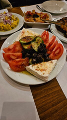 Raki appetizer with cheese olive and tomatoes