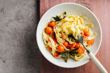 Vegetarian fettuccine pasta with cherry tomatoes.