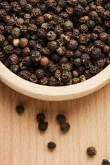 Whole black peppercorns.