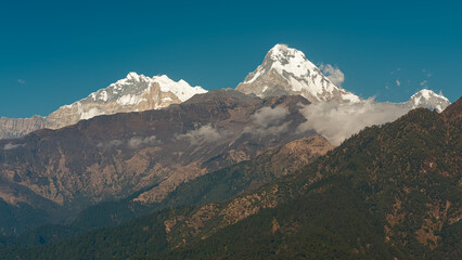 GHOREPANI, NEPAL - JANUARY 9, 2025: Views over the majestic mountains in Ghorepani, Nepal, nature unfolds its beauty in this serene location.