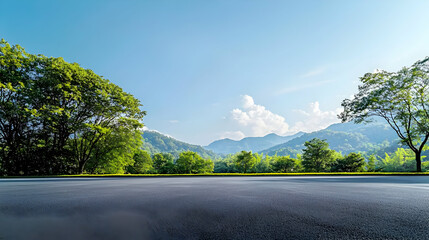 Asphalt Country Road Amidst Lush Green Trees Mountains Under Blue Sky with Fluffy White Clouds in Sunny Morning
