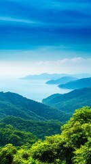 Obraz premium Serene coastal landscape showcasing lush green mountains meeting tranquil blue waters