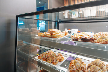 Freshly Glazed Donuts and Sweet Pastries in a Modern Bakery Display