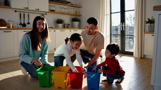 Family learning recycling sorting garbage at home