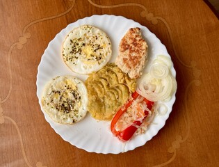 A flavorful Middle Eastern Plate with delightful spreads and fresh seasonal vegetables. A vibrant...