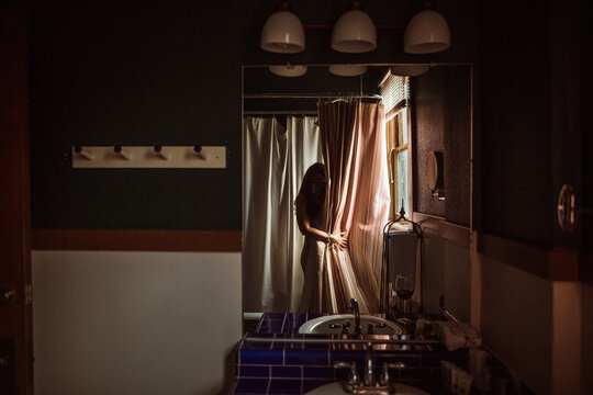 Woman taking photo of herself in mirror