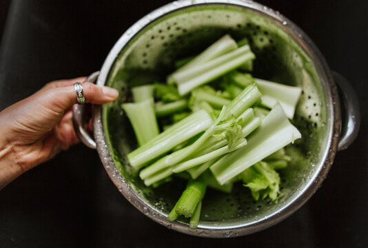Woman's hand holding celery