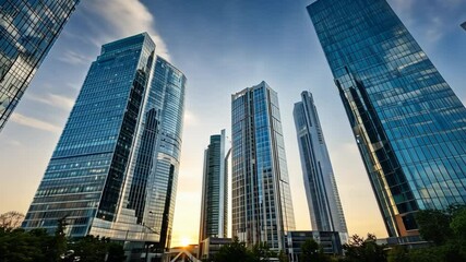 Modern city skyline with towering glass skyscrapers reflecting the golden sunset, creating a stunning urban landscape with contemporary architecture, green spaces, and a business district atmosphere.