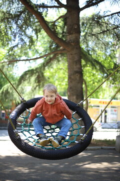 young child on swing