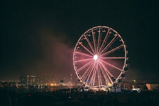 A Ferris wheel at night, lights and city blurred into a magical scene - Powered by Adobe