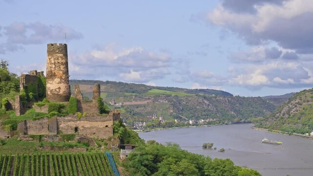 Romantic Rhine River Valley with castle ruins in the foreground on a sunny summer day, Germany