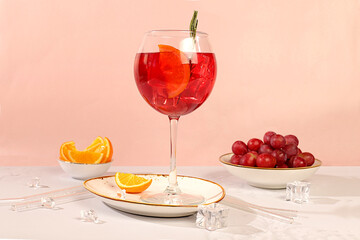 Royal lemonade cocktail with tequila, gin, rum, ice and grapes, bar and party concept, restaurant and cafe advertising card, elegant minimal background, selective focus.