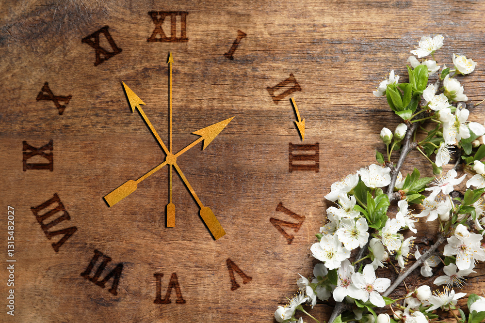 Poster clock and blossoming branch with white flowers on wooden background, top view. arrow showing time ch