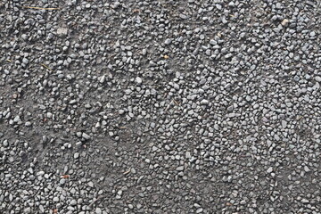 A close up of a gravel road with a lot of rocks on it