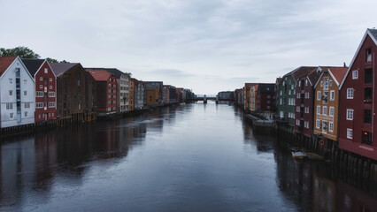 Bryggen Wharf Houses Reflecting on the Nidelva River in Trondheim on a cloudy evening