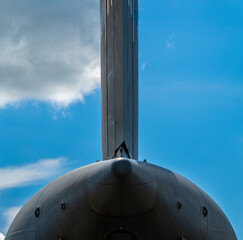 Tail view of the rudder of a large military transport air plane.
