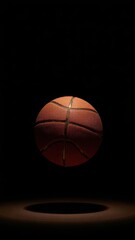 Fototapeta premium Single basketball, perfectly lit, against a stark black background, sports equipment, vector, element