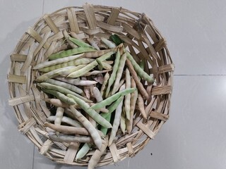 Black turtle bean pods in basket.