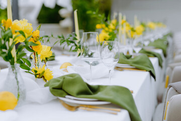 Elegant Dining Table Set with Yellow Flowers and Green Accents