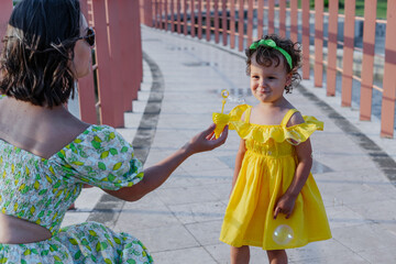 Mother and daughter enjoying a joyful picnic, running in the park, playing by the lake, and having fun in a lavender field. Bright outfits, summer vibes, and heartfelt family moments.