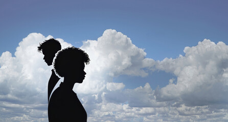 A couple stands apart with backdrop of dark clouds