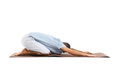 Young man doing yoga on mat against white background