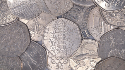 Pile of collectable 50p coins including rare Kew Gardens design coin