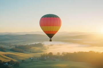 Fototapeta premium hot air balloon rising over a scenic landscape at sunrise or at sunset, minimal background with copy space, traveling adventure, travel agency banner 