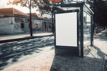 Bus stop advertising mockup with a blank white billboard in an urban street. Modern glass shelter...