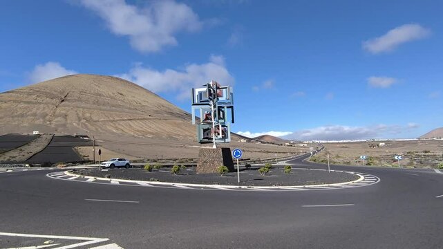 Road roundabout with wind monument designed by C&eacute;sar Manrique, Lanzarote, Canary Islands, Spain.