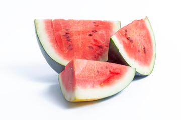 Fresh watermelon slices on a white background highlighting summer fruits, Closeup