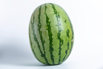 Close-up of a large green watermelon on a white background