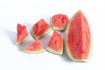 Slices of fresh red watermelon on white background, top view