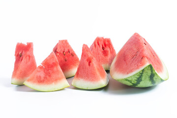 Freshly cut watermelon slices displayed on a white background