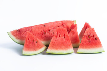 Freshly cut watermelon wedges on a white background for summer refreshment