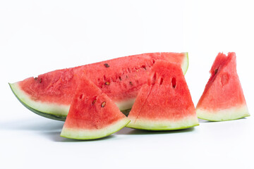 Freshly cut watermelon slices on a white background, closeup