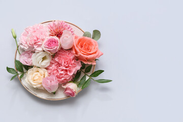 Plate with beautiful floral composition on grey background